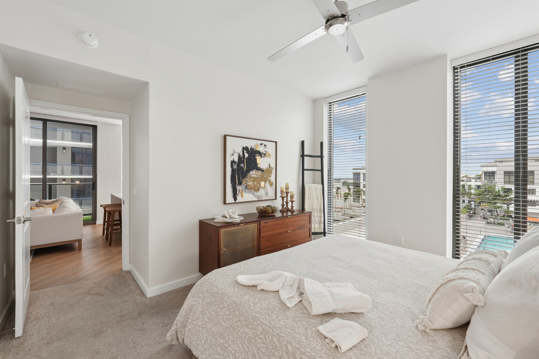 Evo apartment primary bedroom with floor-to-ceiling windows - St. Petersburg, FL